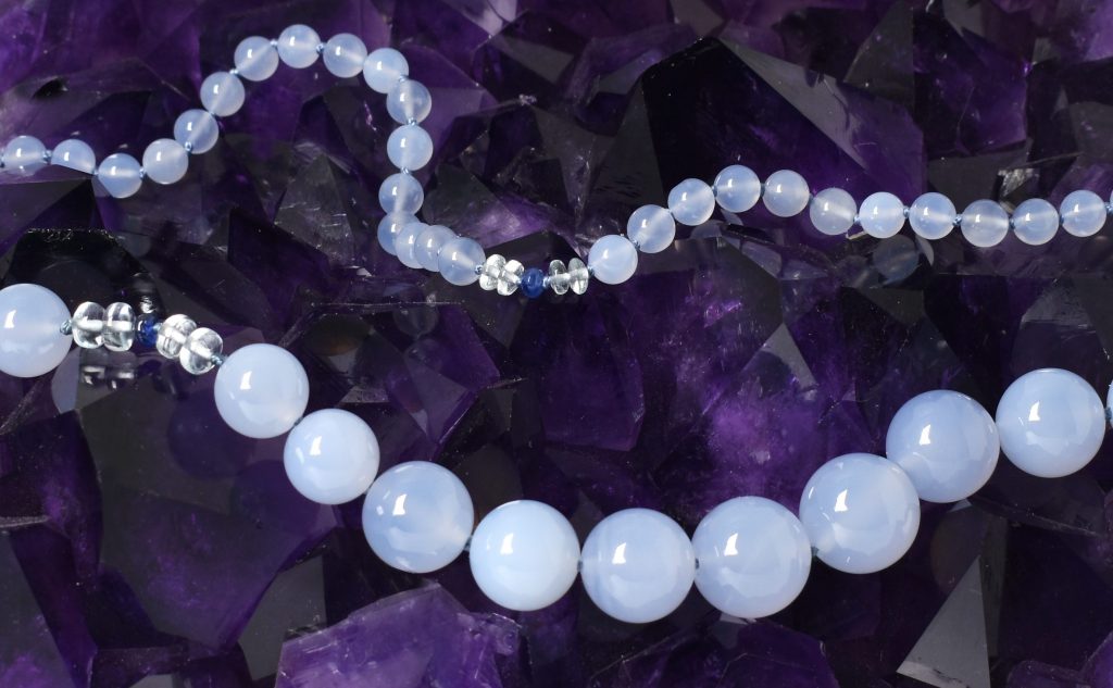 blue chalcedony necklace on amethyst crystal
