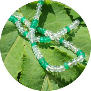 Emerald & White Beryl healing necklace on a leaf