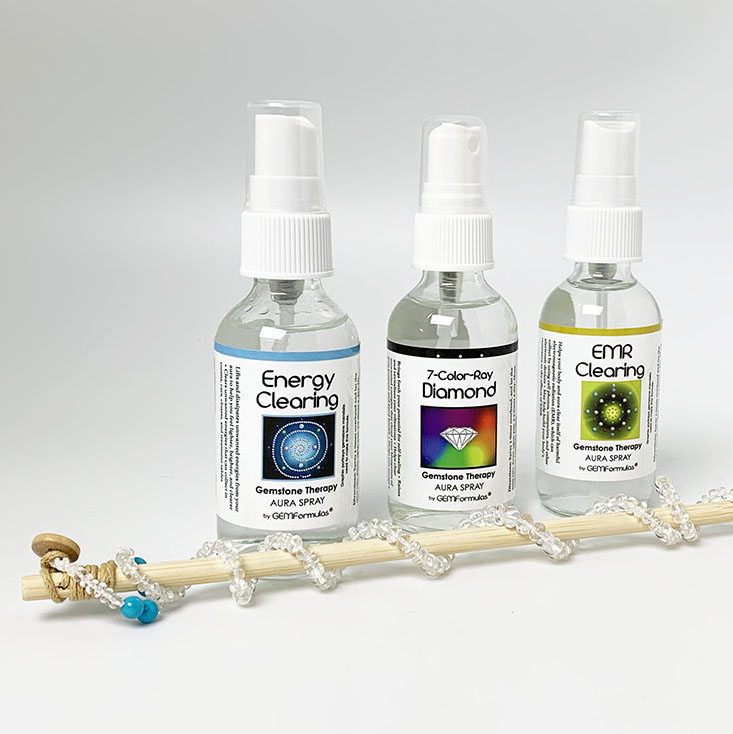 three aura spray bottles and White Beryl necklace on therapy wand