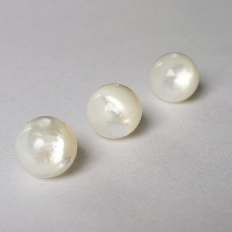 photo of three single gemstone spheres