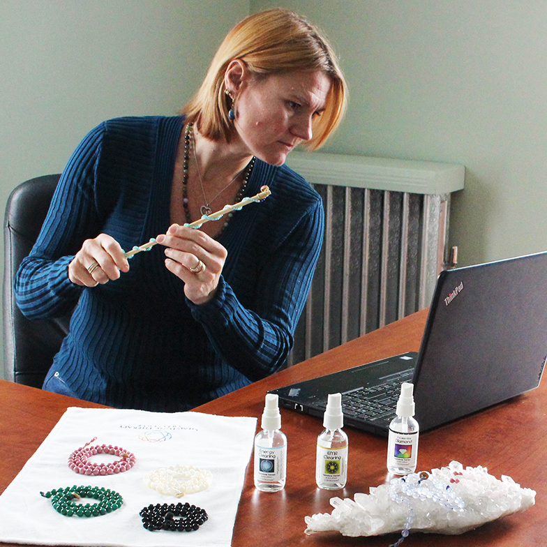 photo of Gemstone Therapy student using a therapy wand