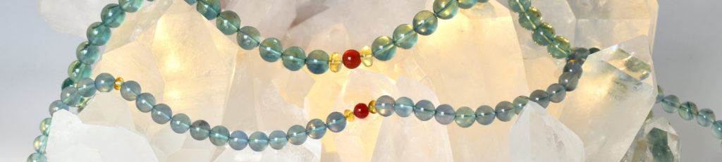 Living River necklace with Blue-Green Fluorite, Carnelian, and Citrine on crystal