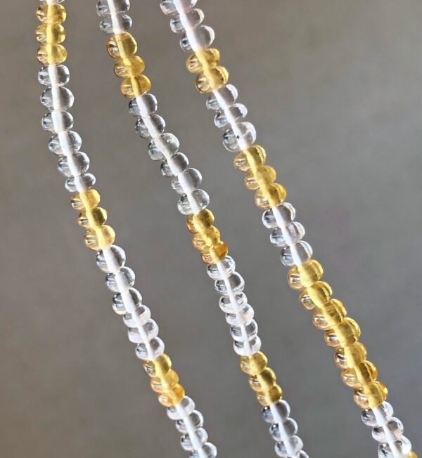 three strands of yellow sapphire and white beryl gemstones