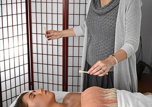 Practitioner giving a Diamond Therapy session