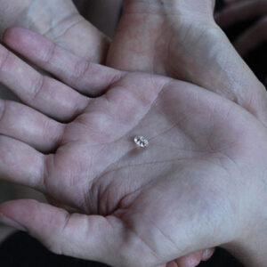 Client holding Therapy Diamond in hand