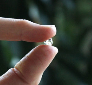 Healing Diamond held between fingers