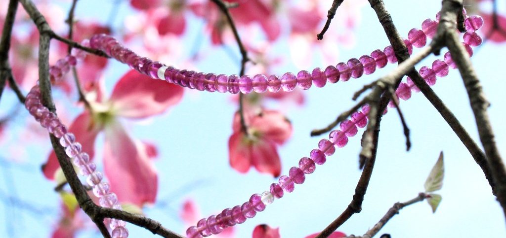 Pink Tourmaline & White Tourmaline necklace hanging in tree