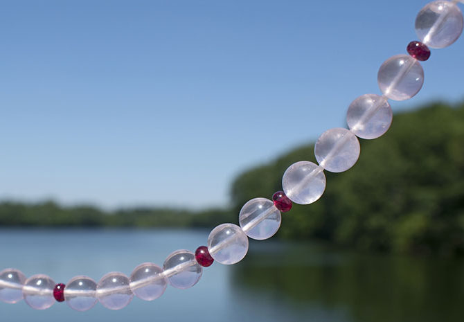 rose quartz gemstone necklace by lake