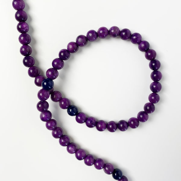 Closeup photo of spiraled sugilite gemstones